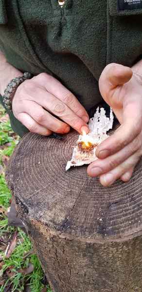 Making fire with birch bark